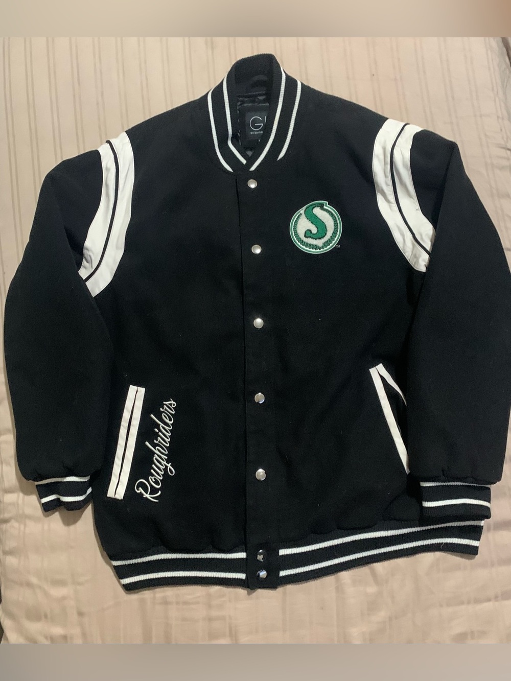 Roughriders black and white Jacket by giii sports by Carl banks with Green Crest